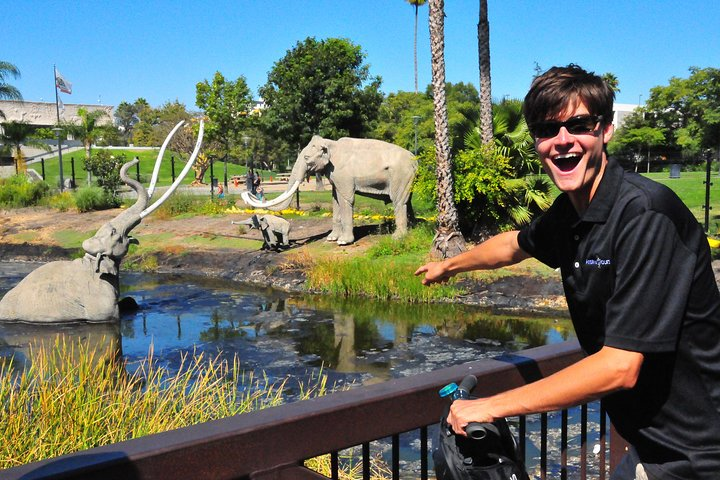 Discover the La Brea Tar Pits on a Segway encountering life-sized replicas of prehistoric creatures amidst unique natural settings all while learning about this fascinating historical site.